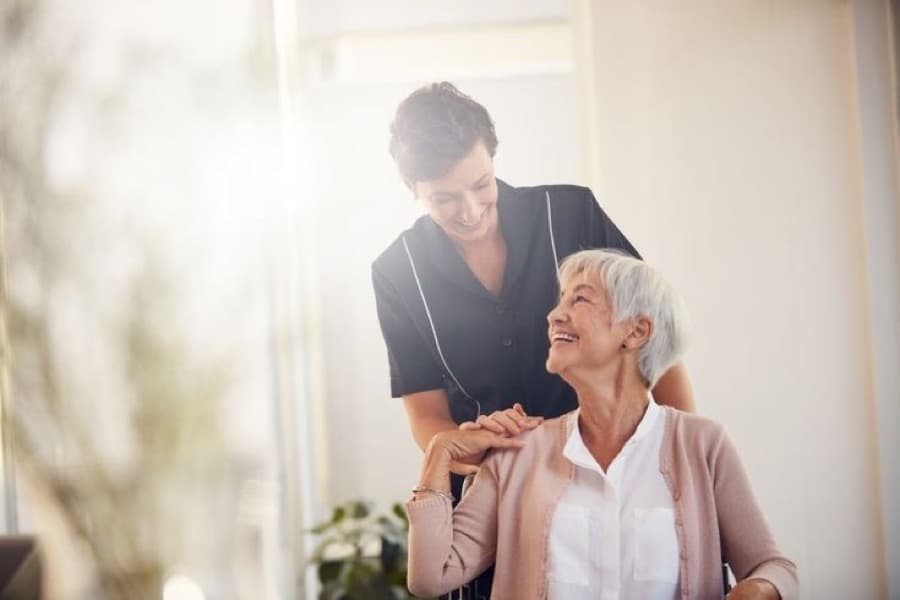 Carer sharing a smile with a resident